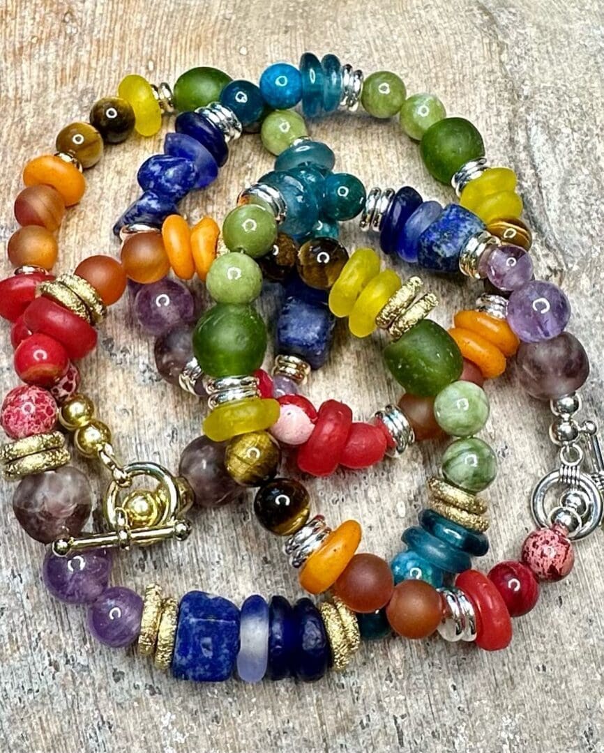 A colorful necklace with many different colored beads.