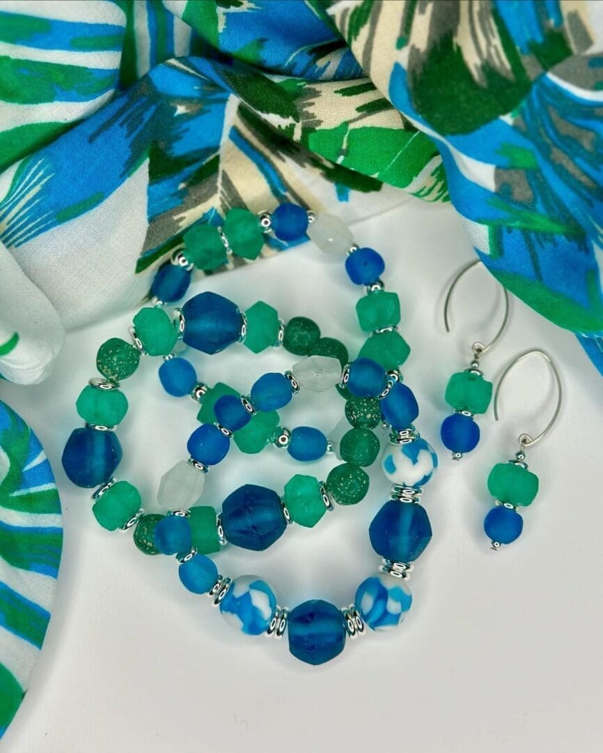 A necklace, bracelet and earrings set in shades of blue.